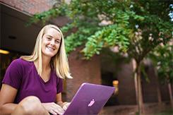 Student studies outside of Music Mass Communication building